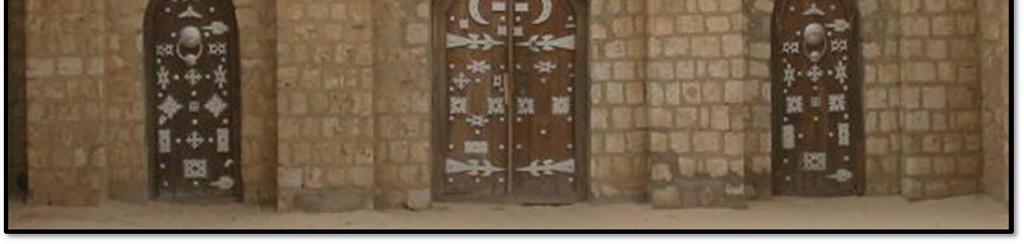 A carpenter made the doors of wood and decorated them with ironwork symbols. Notice the crescent moons on the center door.