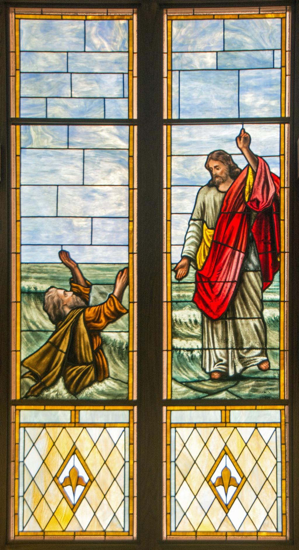 JESUS WALKING ON THE WATER As you face the Altar in the center aisle of the church, look to your right to the picture of Jesus reaching down to catch Peter.