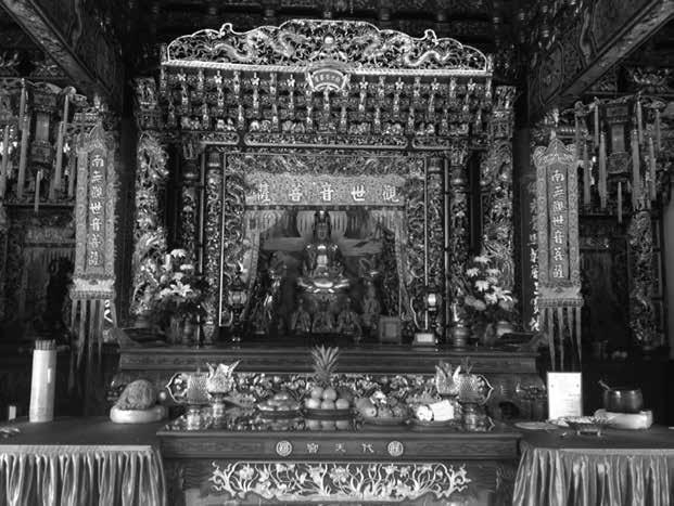 7 Statue of Guanyin in a folk shrine,