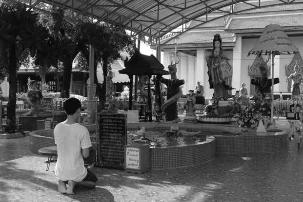 6.3 A man is chanting in front of the statue of Guanyin at Wat Mahabut, Bangkok. 7. Guanyin and Charity Guanyin belief and practice often go together with social organizations and social charities.