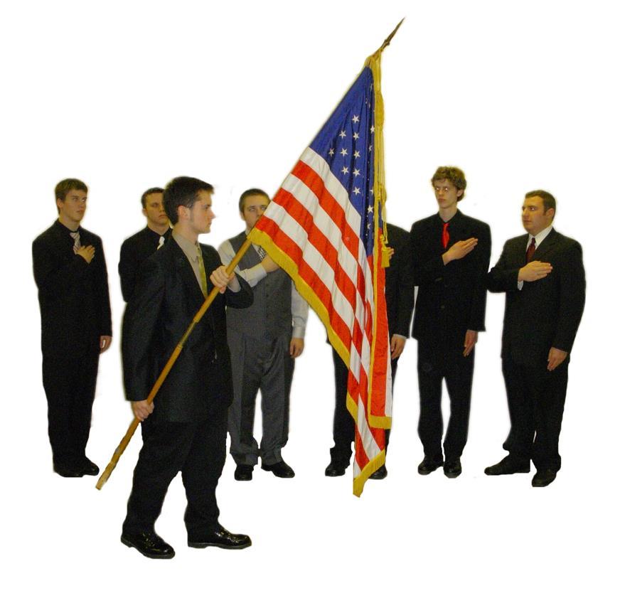 Figure 5 Officer carrying the National flag Standing at attention means that a person stands with head and body erect facing the flag.