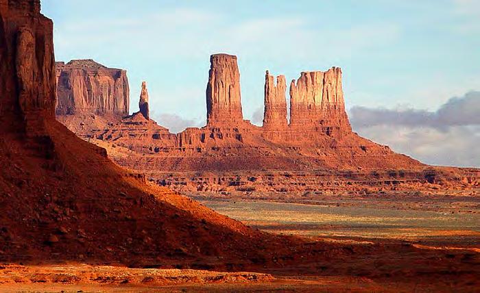 Its wide, flat, desolate landscape is magnificently interrupted by the crumbling rock formations rising hundreds of feet into the air, which are the last remnants of the sandstone layers that once