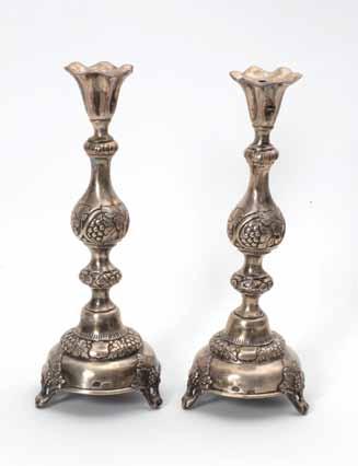 115 114 115. A Pair of Silver Candlesticks Poland, 19th Century A Pair of candlesticks, manufactured by J. A. Goldman Warsaw, Poland, 1880. Silver (has several stamps), embossed and engraved.