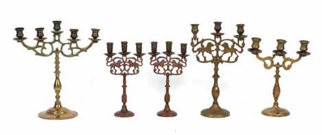 4. Two Shabbat candlesticks, for three candles. Cast and engraved brass. Stamped: NY Brass. New York, [beginning of 20th century].