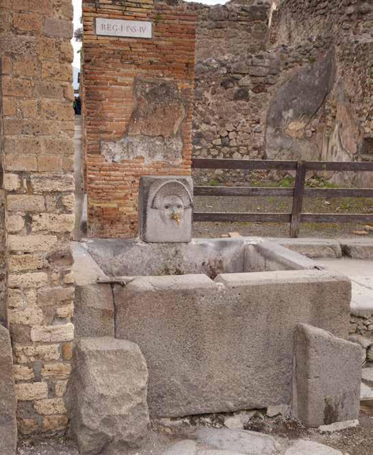 The ruins of Pompeii, including this water fountain, give us a glimpse of daily life in Rome.