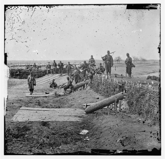 Federal Soldiers [Group of Federal soldiers in onfederate fort on heights of entreville with Quaker guns]. arnard, George N.
