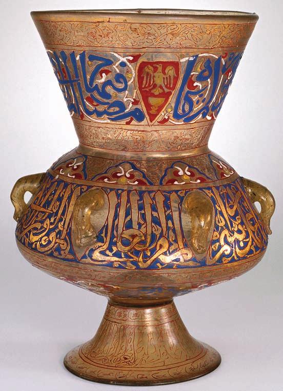 is typical of the period, consisting of a conical neck, wide body with six vertical handles, and a tall foot. Inside, a small glass container held the oil and wick.
