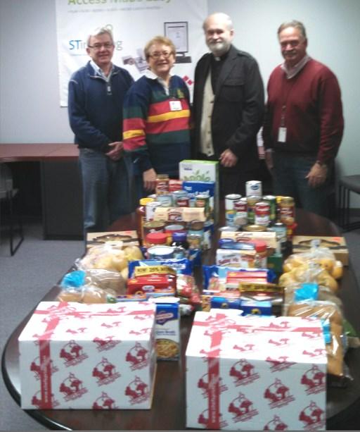 Volume 92, Issue No. 12 31 Western Diocese This is the third year that the employees of Graphic Sciences, Inc. in Madison Heights, Michigan have donated food to families in need at Thanksgiving.
