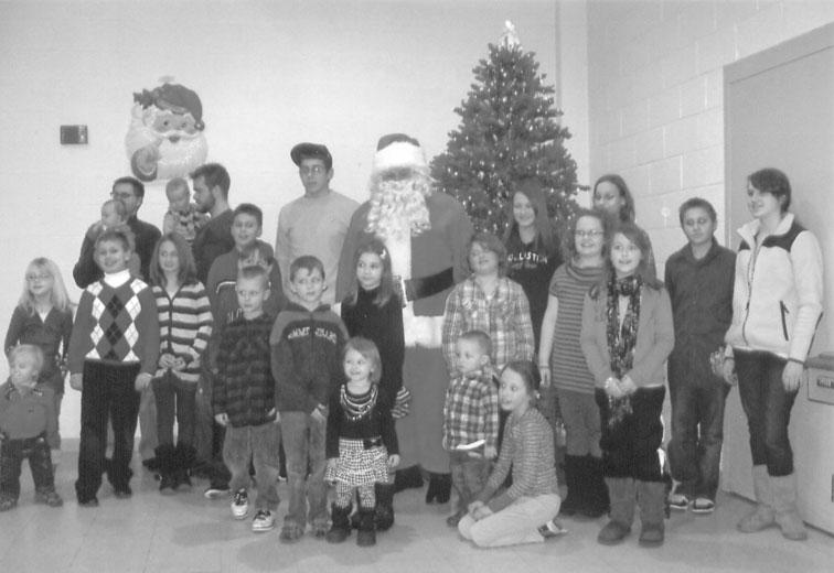 Santa s arrival stopped the activities while he presented each child with a gift.