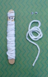 Wrap a craft stick in felt strips and decorate with googly eyes.