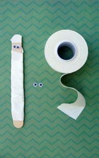 Wrap a craft stick in white yarn and decorate with googly eyes.