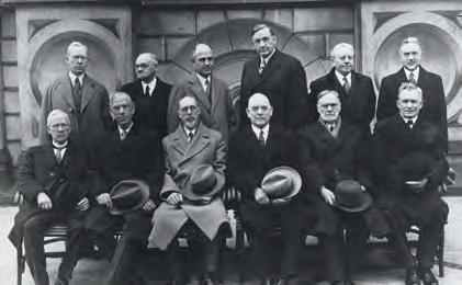 The Quorum of the Twelve Apostles in 1921. Elder Joseph Fielding Smith is standing on the far left.