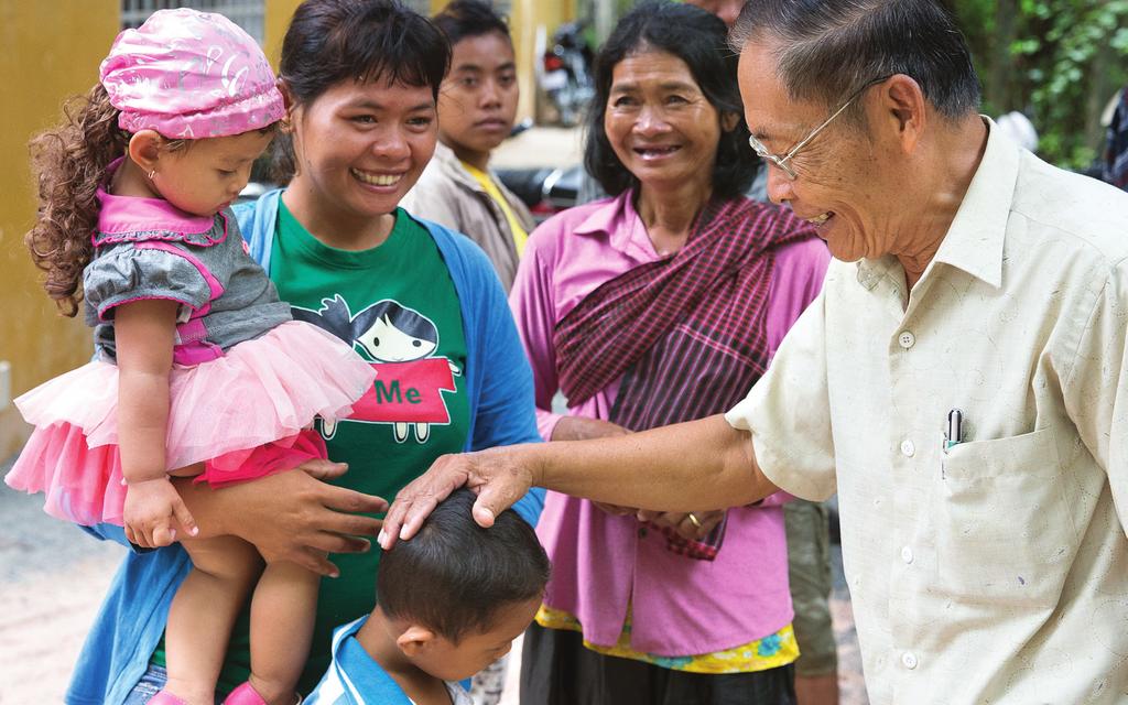 Top left: Pastor Khan, right, Ream s father, greets the children after church. After giving his life to Christ, Khan began planting churches throughout Takeo Province.