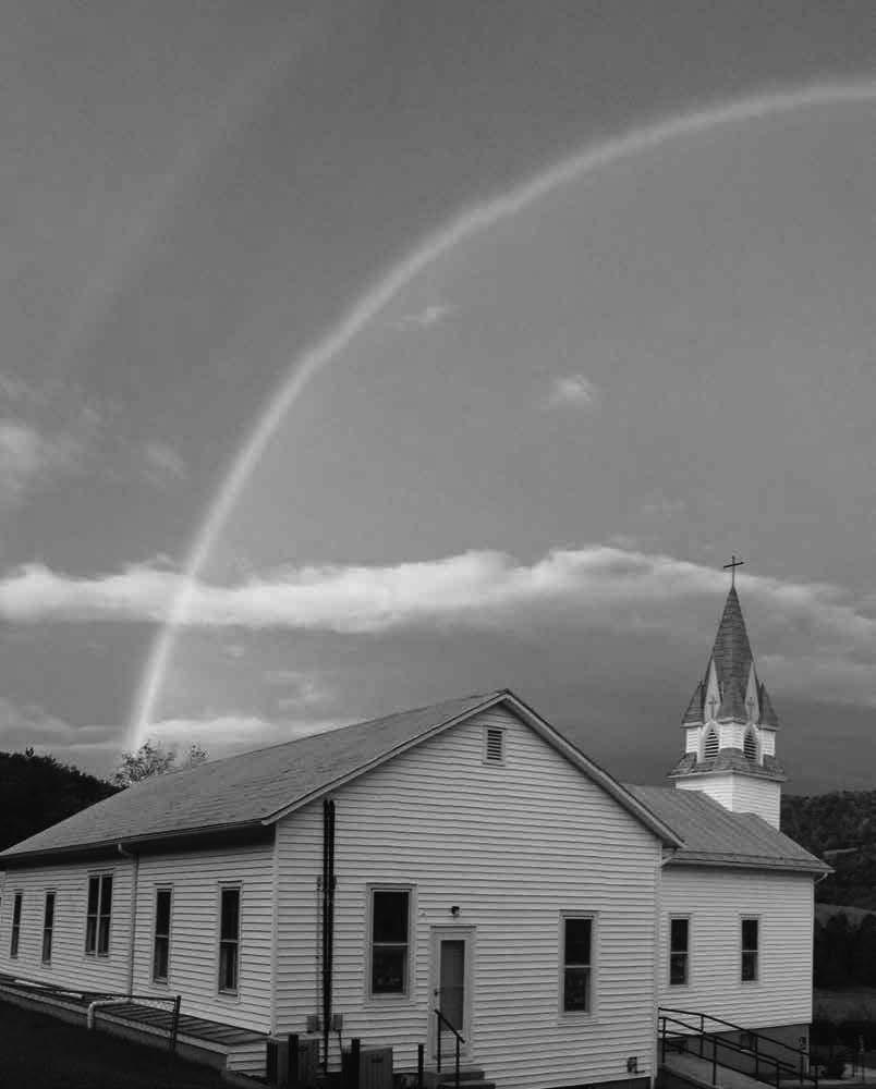 Church in rural America By Megan Brandsrud A rainbow frames St.