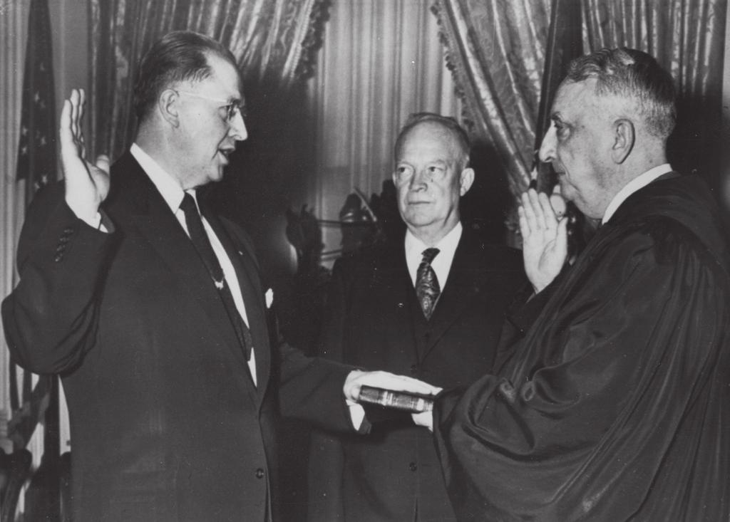 Ezra Taft Benson 127 Fig. 3. Ezra Taft Benson is sworn in as U.S. secretary of agriculture as President Dwight D. Eisenhower looks on.