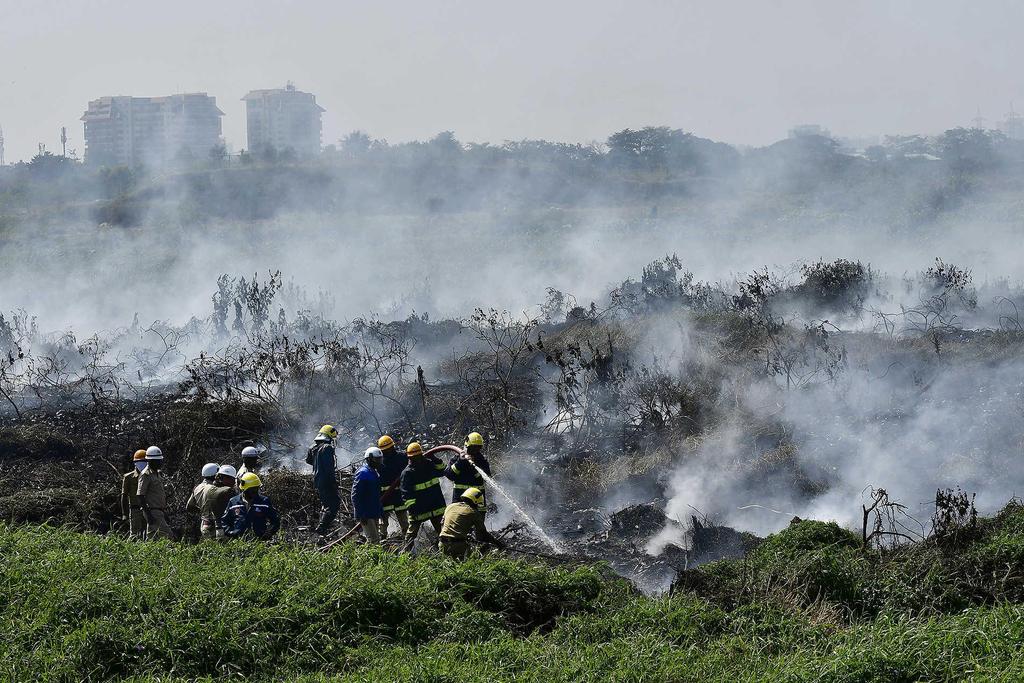 *. Nature smoulders Firefighters struggling to extinguish a fire that broke out in the polluted Bellandur Lake in