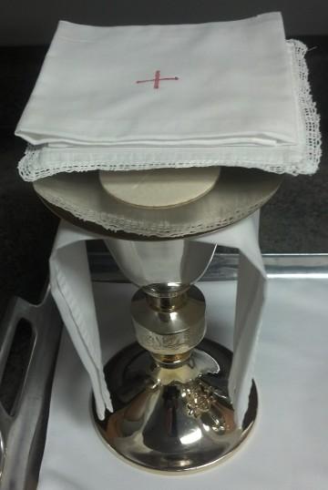 4. Set up of the Credence table. Place the following items on the small table near the tabernacle.