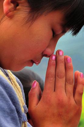 3 Question 2 Revelation Look at the photograph below which shows a child praying. 0 6 Explain briefly how praying might help someone to know God.
