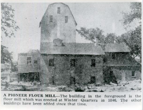 Kimball Gristmill marker site consists of a gristmill replica, two original burr-type grist stones, and three pillars dedicated to three men involved in the