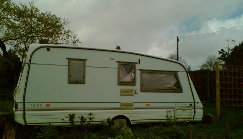 In the garden, a small, self-catering caravan enables people