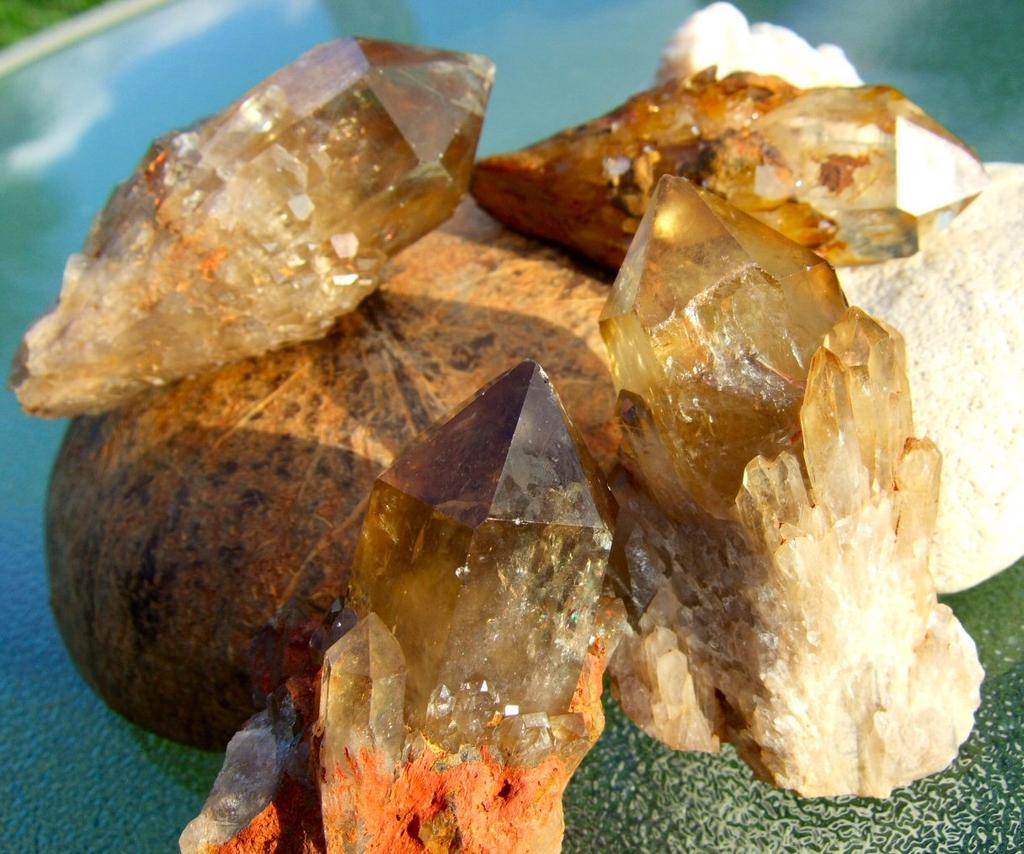 Citrine Citrine is a yellow quartz but actually comes in many shades from light champagne to a deep iced tea color known as Madeira Citrine.
