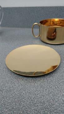 Paten A small flat dish that is sometimes used for the large host