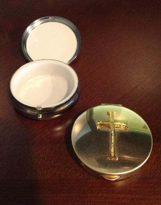 Pyx A small container with a cover that can hold the Eucharist for giving to