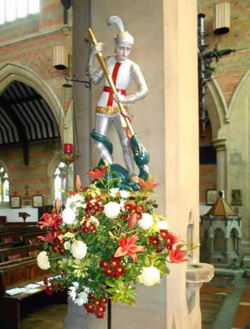 The rood beam and St George and Dragon sculpture are by Ninian Comper, c.