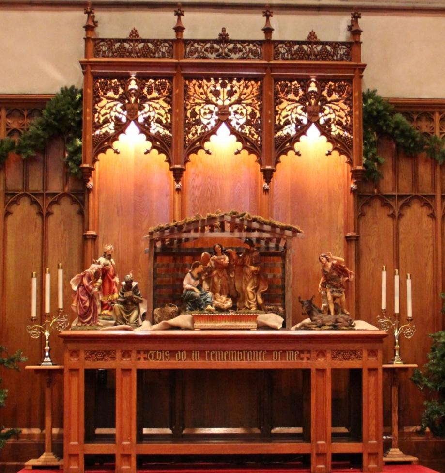 The reredos canopy of the table signifies the Burning Bush, The Lamb of God and the Crosa and Crown.