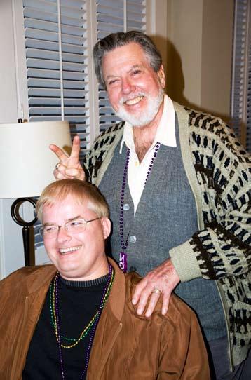Clockwise from right: Treasurer Mark Dermit and Editorial Committeeman Herb Arbuckle clown around in the Mardi Gras-themed hospitality room at the Tremont Hotel
