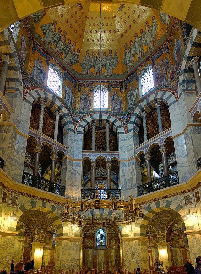 Carolingian Art Palatine Chapel, Aachen Central plan, topped by an octagon Built for Charlemagne Inspired by San Vitale Capitals taken from old Roman monuments Large heavy appearance Arches smaller