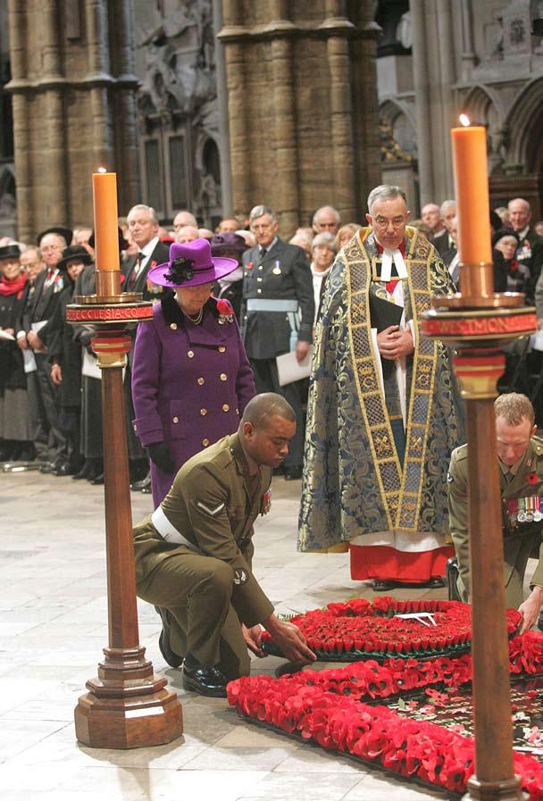 The Very Reverend Dr John Hall Lance Corporal Johnson Beharry VC and Trooper Mark Donaldson VC lay a wreath