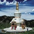 THE GREAT STUPA OF DHARMAKAYA - WHICH LIBERATES UPON SEEING - Rising among wooded hillsides, The Great Stupa of Dharmakaya crowns a meadow at the upper end of Shambhala Mountain Center s