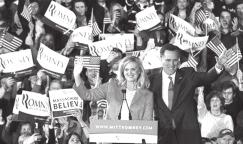 Mitt Romney waves to supporters along with his wife Ann at his Super Tuesday primary election night rally in Boston, Massachusetts, on 6 March, 2012.