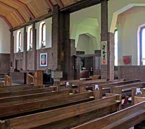 of schoolrooms. The church, although having a conventional cruciform plan and built in the Early English style, is unusual in that its orientation is north-south.