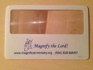 00 Totebags are solid royal blue, sturdy canvas bags with the Magnificat logo printed on the front. Measurements: 13.