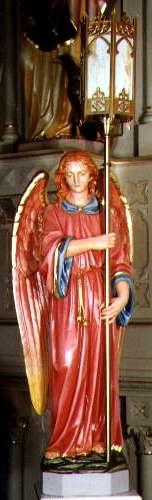 It is flanked by sentry angels to illuminate the Tabernaclewhere the consecrated Host is reserved.