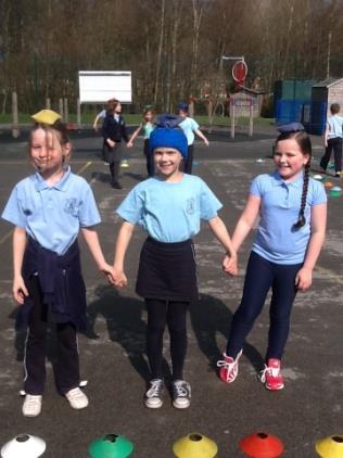 We had to work together to complete challenges like holding hands and balancing a bean bag on each of our heads, if someone s bean bag fell off their head the others in their group had to help pick