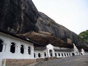 Visit *Dambulla Cave Temple is a vast isolated rock mass 500ft high and a mile around the base. Here is found the famous Rock Temple dating to the First Century BC.