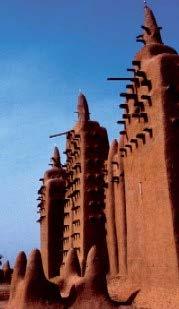 Architecture Early forms: Soudanese style common Use of clay, tolon: scaffolding of wood stakes (decorative and functional), buttresses for support, mihrab tower, flat roof Fortress like exterior