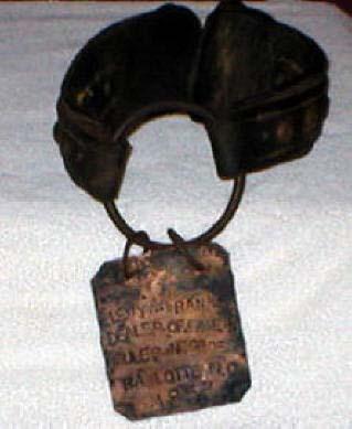 This is a slave collar. The inscription reads: "Levy M. Rankin, Dealer Of Fine Mules & Negroes. Charlotte, N.C. 1853.