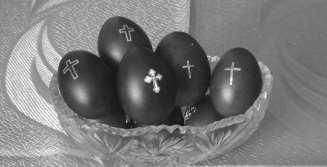 At the end of the Divine Liturgy, the red Easter eggs are blessed and distributed to the congregation, who carry their lighted candles to their homes where they break the fast in joy and celebration