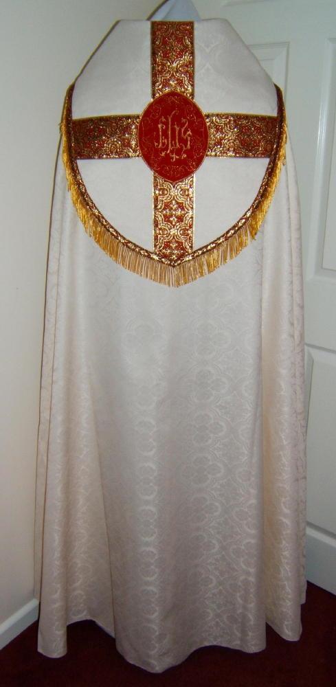 Cope A long cape worn by priests and bishops at certain religious rites.