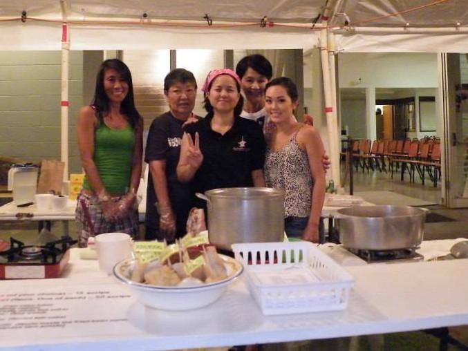 The Hawaii sangha participated with offering candles for ancestors, food booths,