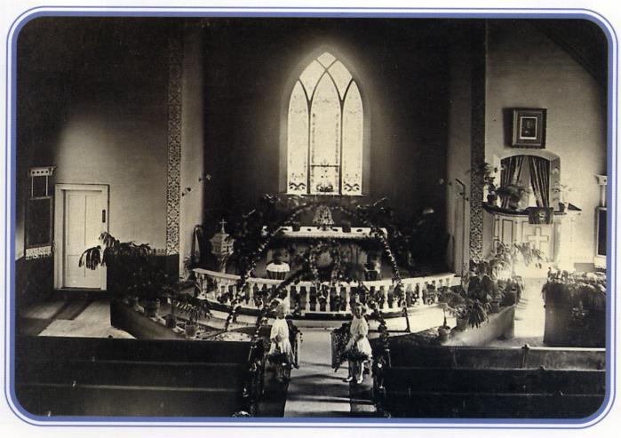 Luther's photo hangs above the altar and the baptismal font located behind the communion rail is now at the chapel at White Pine Village.