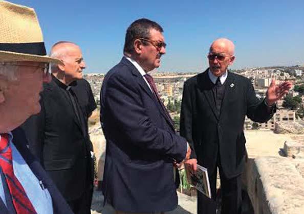 XIV Newsletter N 48 - FALL 2017 Brother Peter Bray, Lasallian religious and president of the University of Bethlehem, shows the Governor General the Palestinian geographic situation from the