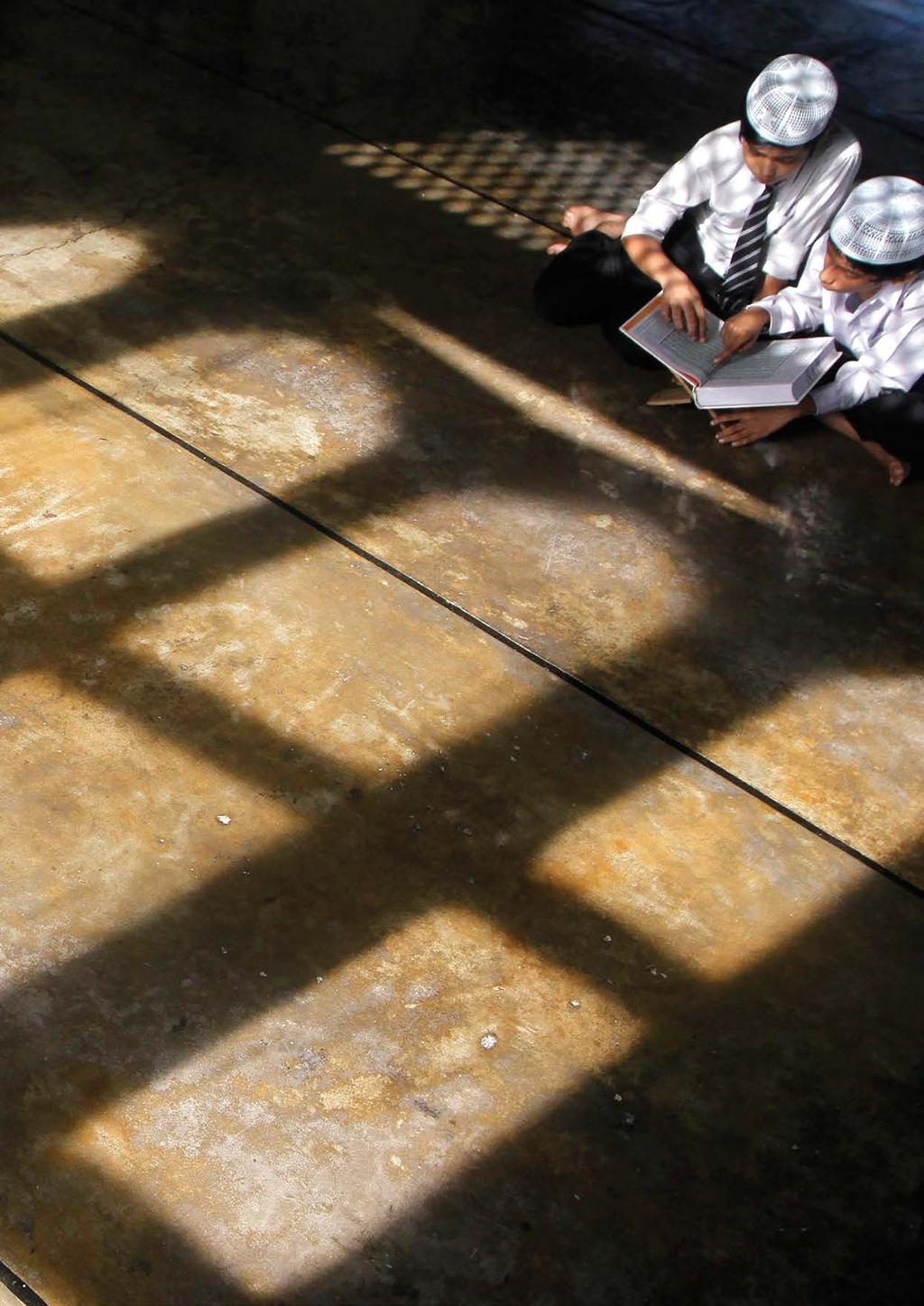 INTRODUCTION Muslim boys read Koran inside a mosque during the holy month of Ramadan in Kolkata