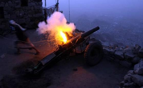 Yemeni man fires a cannon to mark the