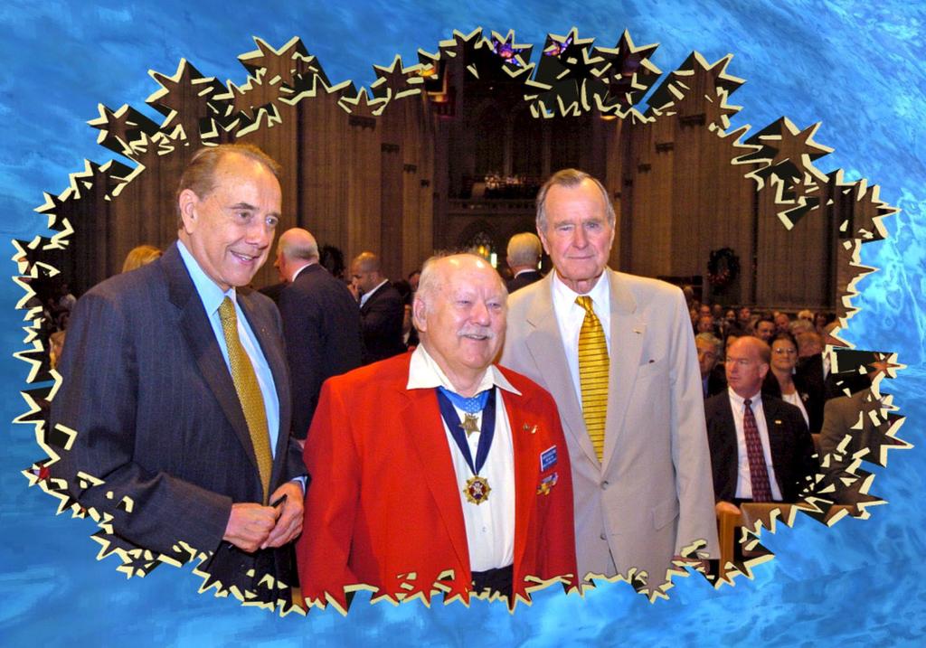 Medal of Honor Recipient Jack Lucas (USMC) joins fellow World War II veterans Senator Bob Dole and President George H.W. Bush in the ceremonies to dedicate the new memorial in Washington, D.