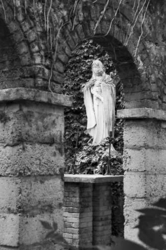 P erhaps behind the garden altar, where now stands a statue of Holy Mary, she might